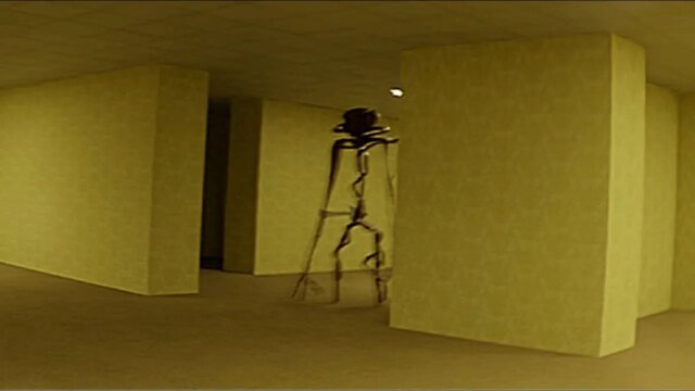 A-strange-figure-in-a-yellow-hallway-in-the-short-film-The-Backrooms.jpg