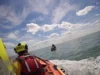 Tripulação da RNLI interrompe evento público para fazer resgate real