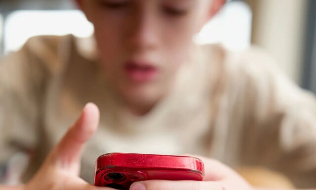 a-boy-using-iPhone.jpg
